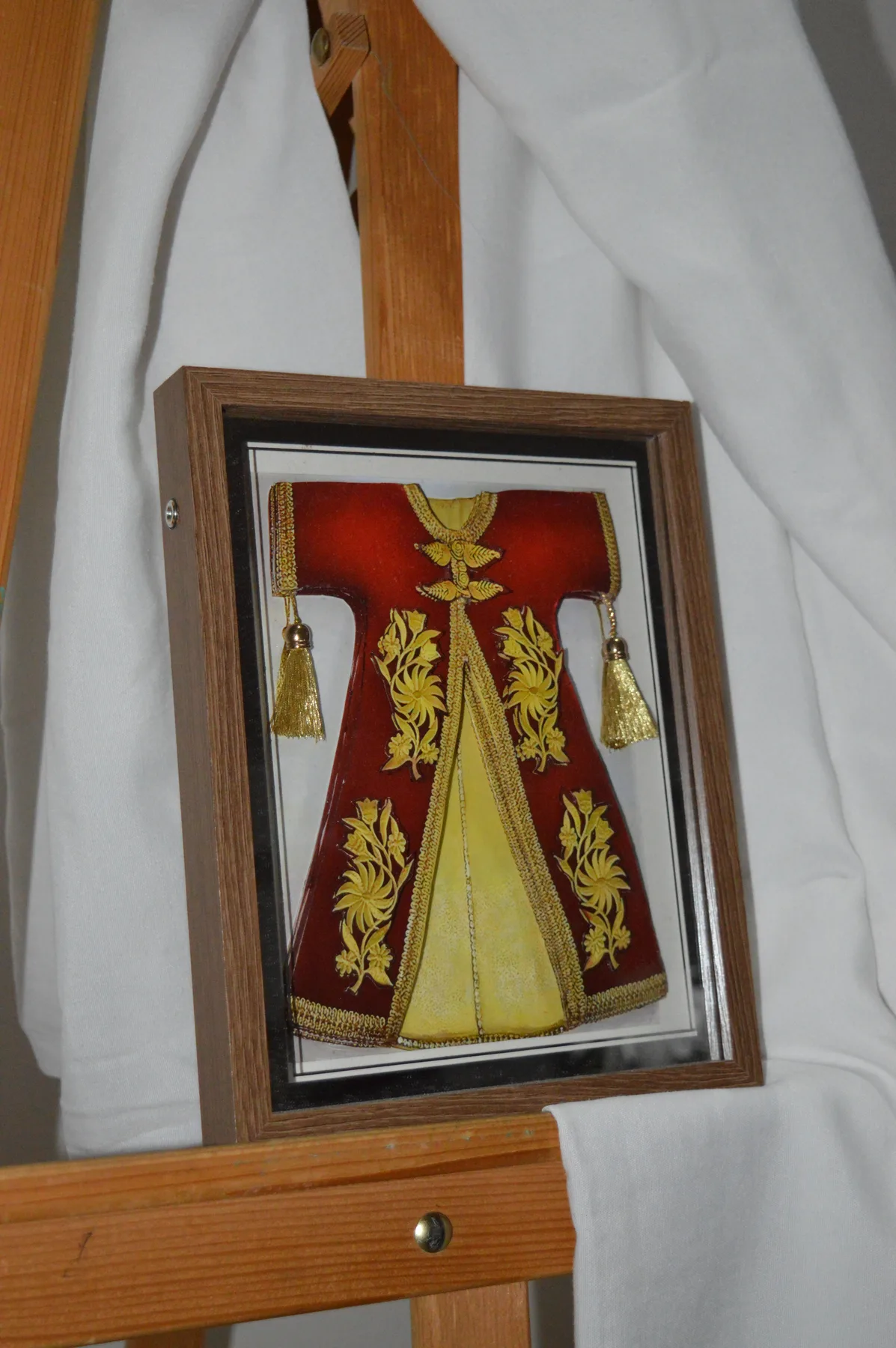 Framed red and gold paper relief tableau